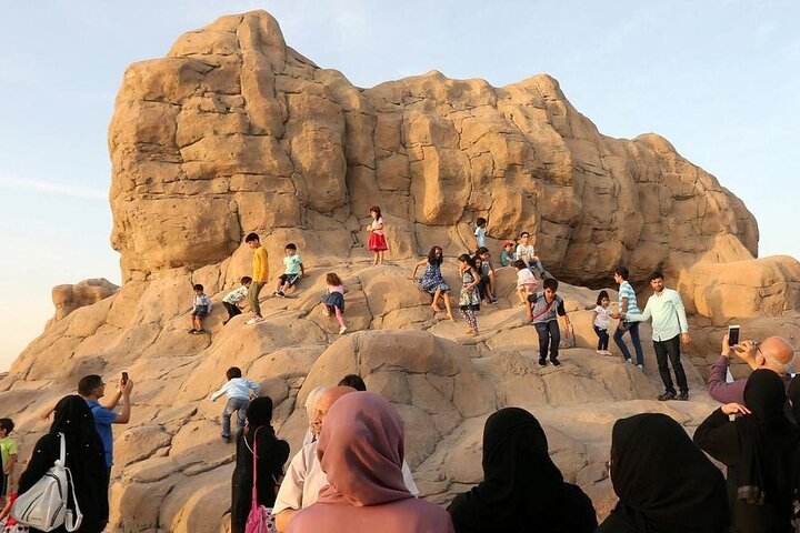 Children energetically explore the rocky landscape of Quranic Park creating unforgettable memories while families enjoy the surrounding beauty all while learning about Islamic heritage and the Holy Quran.